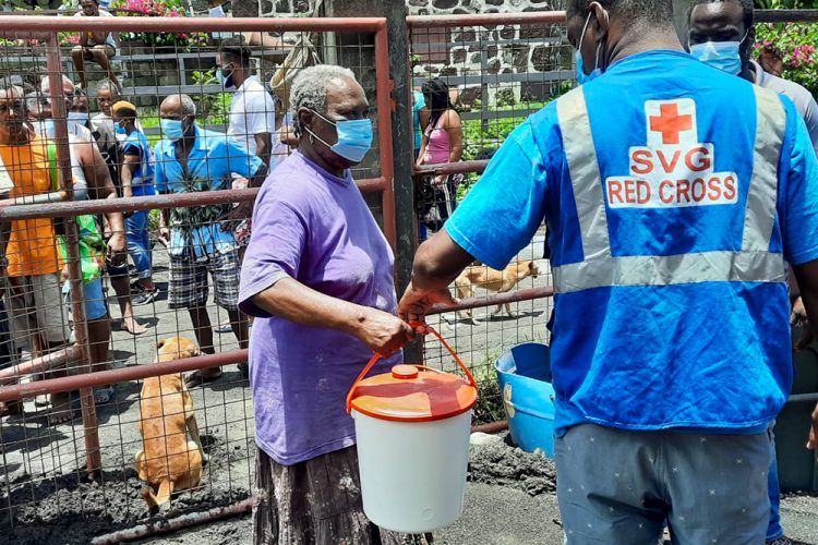 Red Cross volunteers distribute kits in North Windward